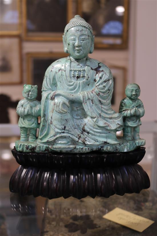 A Chinese turquoise matrix group of a buddha and attendants, circa 1900, 6.75in. 9in. overall